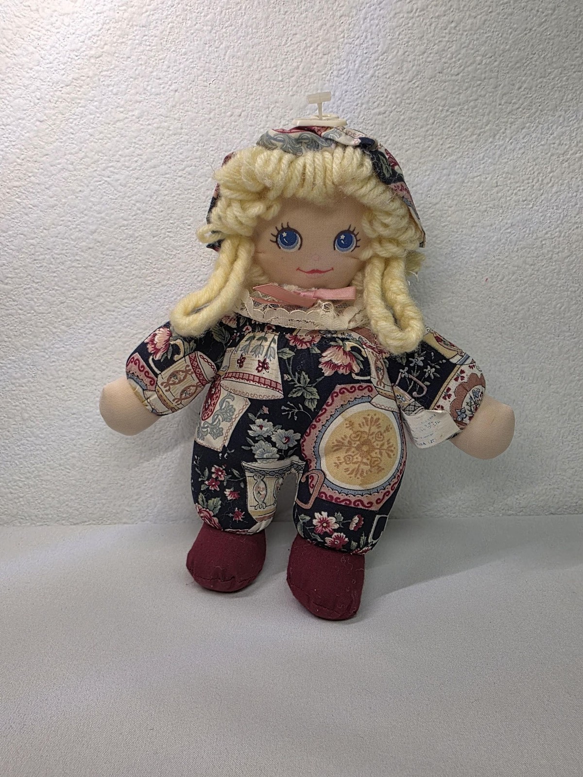 Vintage Rag cloth fabric doll with yellow yarn hair and blue eyes folk art