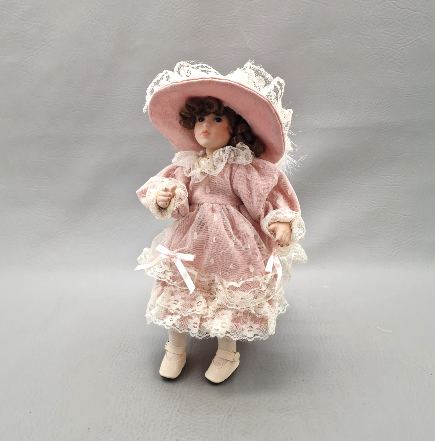 Vintage Porcelain Girl Doll 10″ Tall, Blue Eyes, Curly Brown Hair, Outfit, Hat