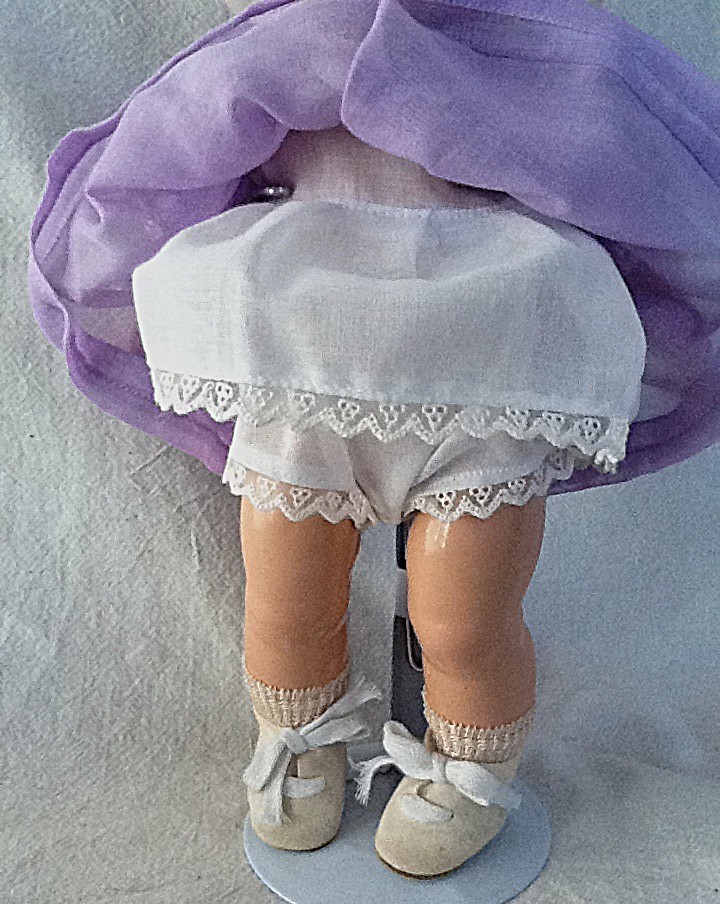 Vintage 11 1/2″ Madame Alexander Baby Composition Dionne Doll in Lavender Cecile