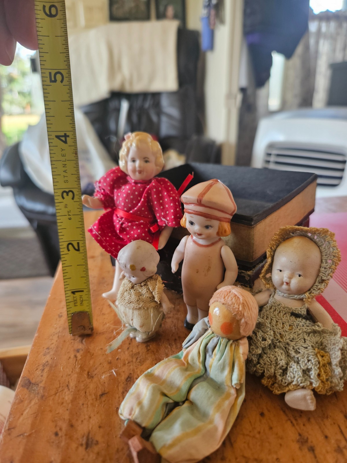 4 bisque dolls 1 wood doll from 1910s to 1980s penny dolls cake toppers etc.