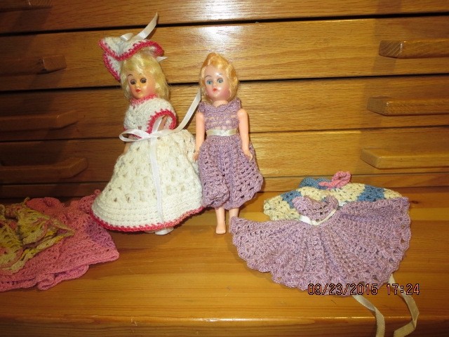 2 VINTAGE 7 1/2″ DOLLS WITH 6 HAND CROCHET DRESSES–#T 4A-7