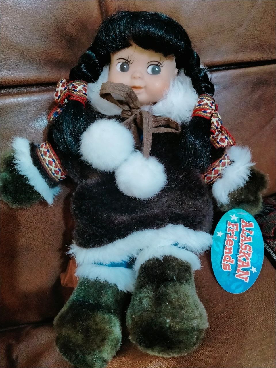 Plastic doll with a sign (Environmentally friendly) With a dense fabric body.