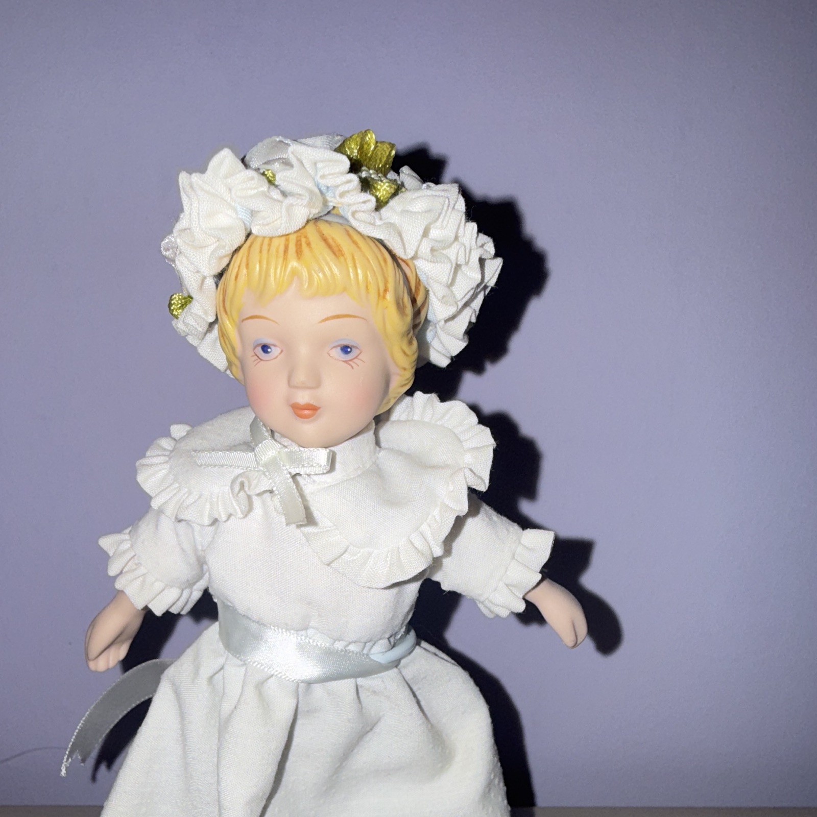 Porcelain Girl Doll Blonde Straight Hair Blue Eyes White Dress Bonnet Stand