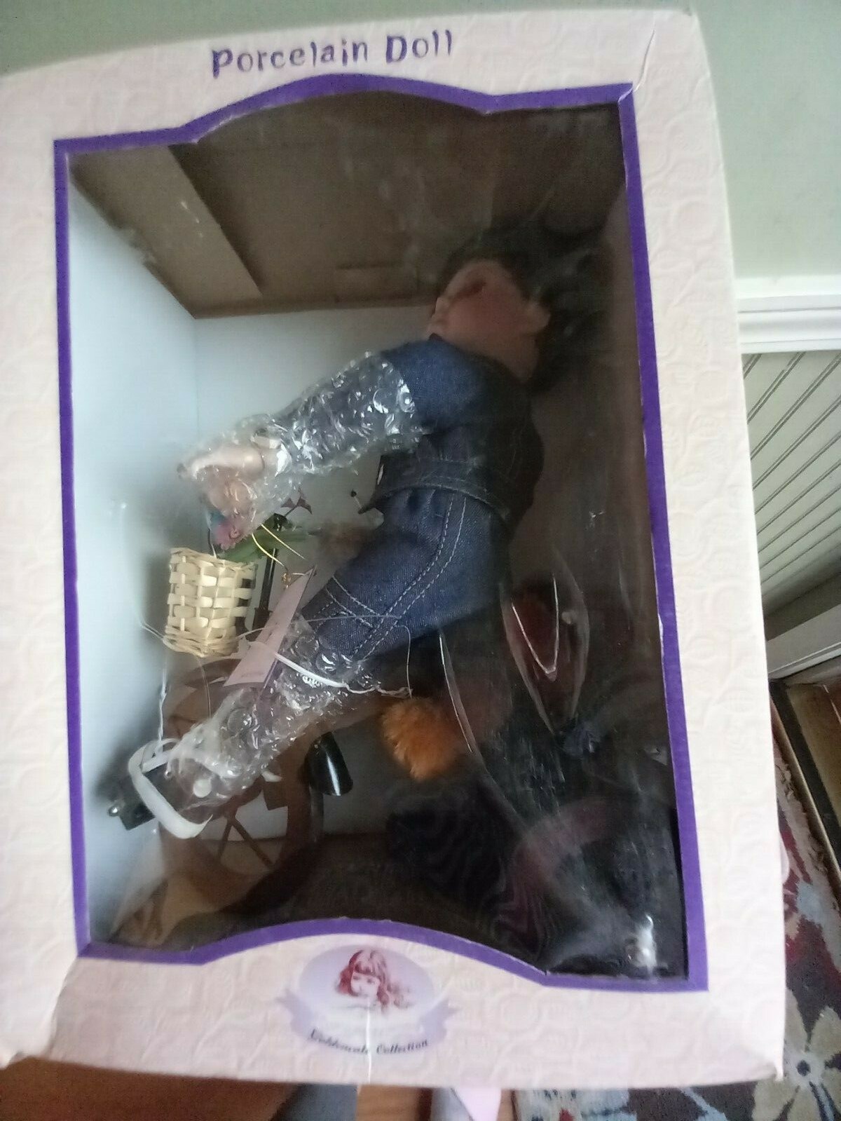 Boy riding his tricycle, Porcelain doll, Goldenvale