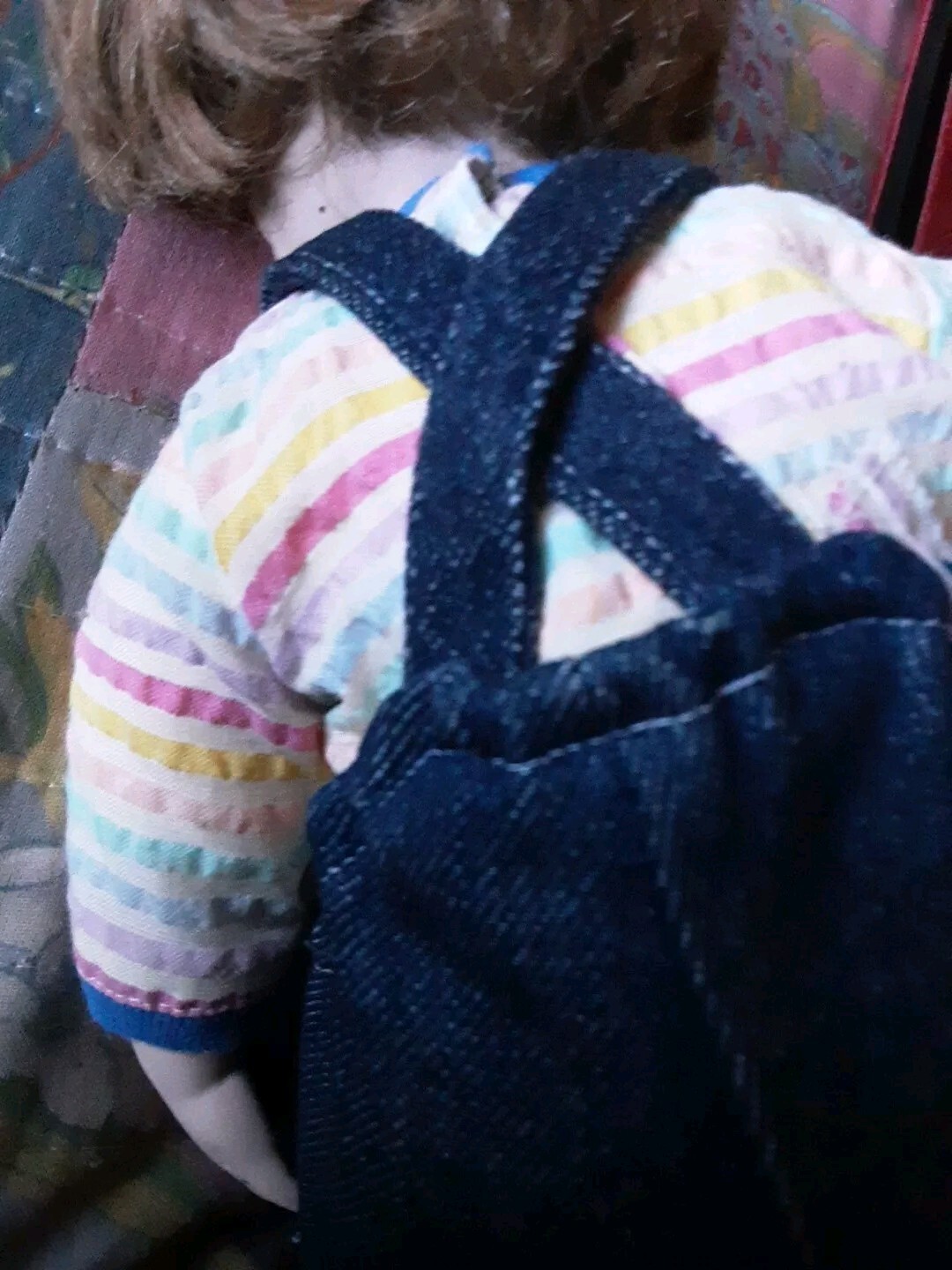 A Child Eating Chocolate Cone Porcelain Doll In Overalls