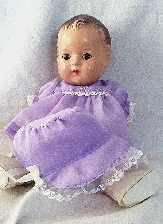 Vintage 11 1/2″ Madame Alexander Baby Composition Dionne Doll in Lavender Cecile