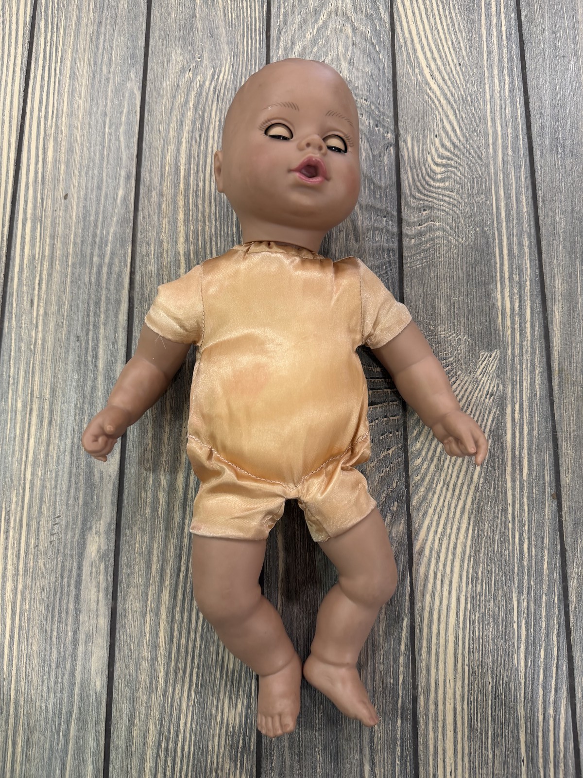 Baby Doll Dark Skin Tone Bald Sleeping Eyes Peach Romper Soft Body Vinyl