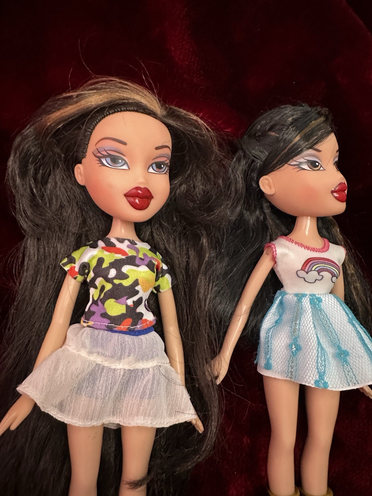 Two bratz dolls with random clothes and shoes