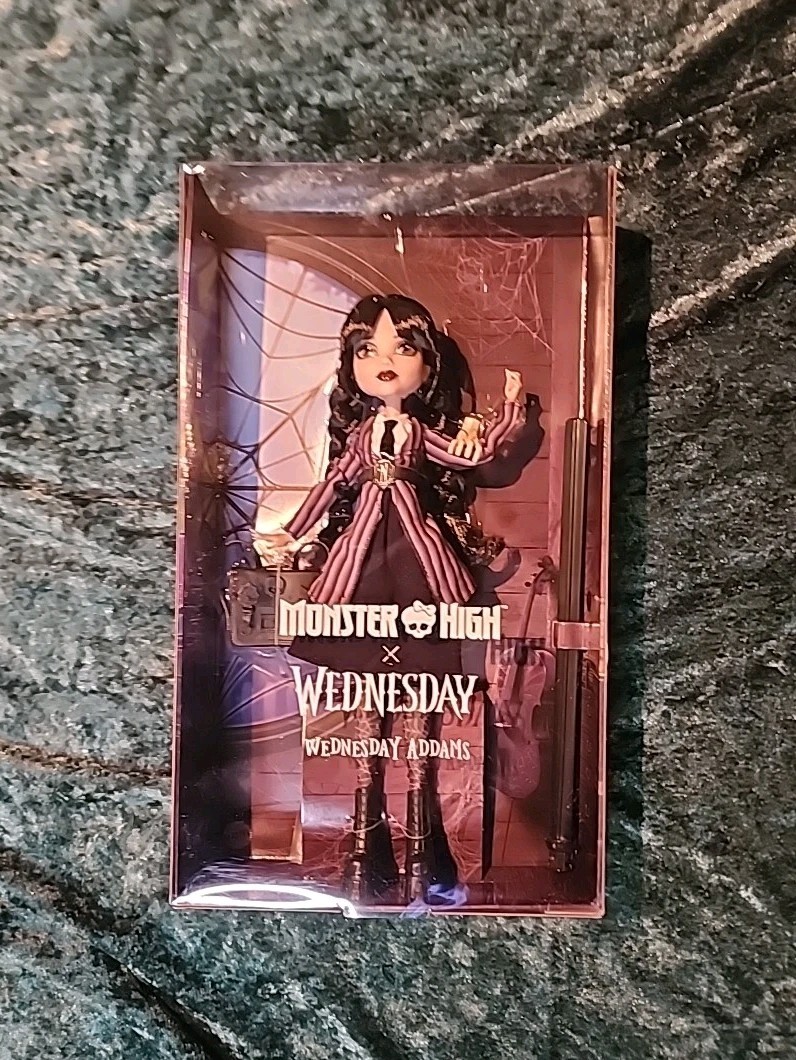 WEDNESDAY ADDAMS MONSTER HIGH X WEDNESDAY DOLL NETFLIX IN HAND