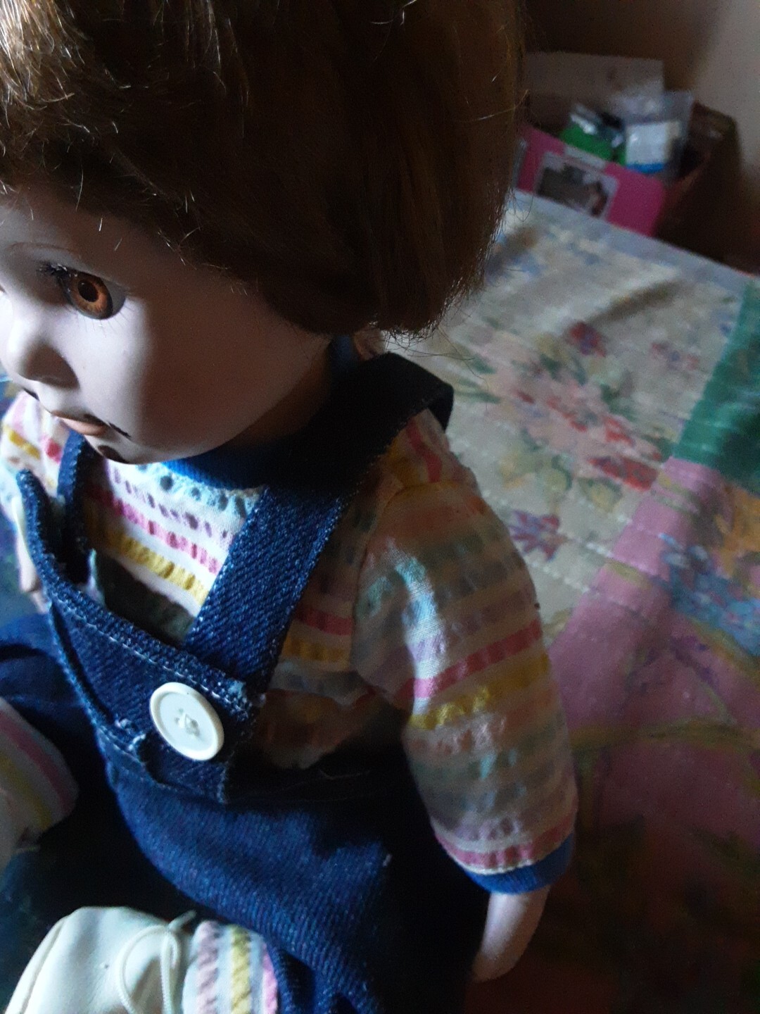 A Child Eating Chocolate Cone Porcelain Doll In Overalls