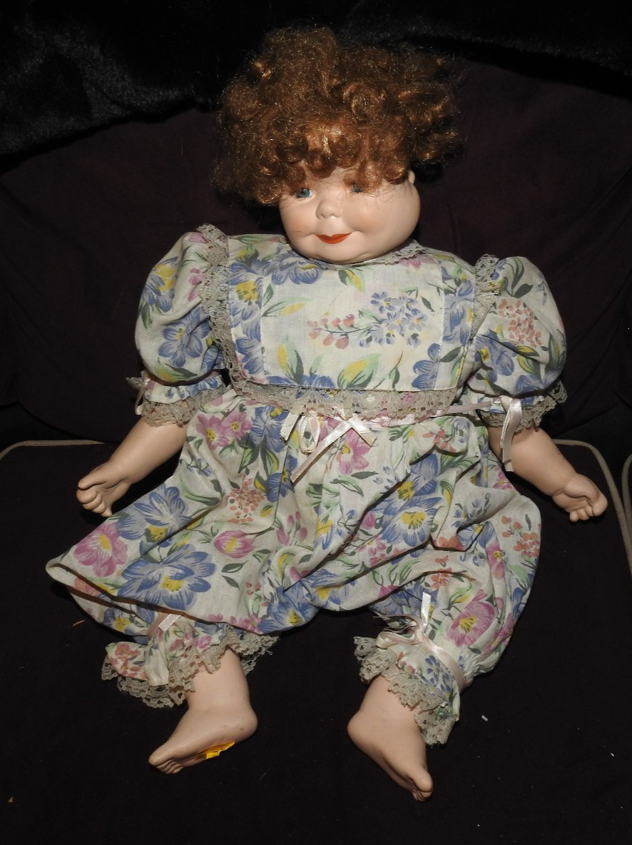 Three faced rotating head porcelain doll, signed