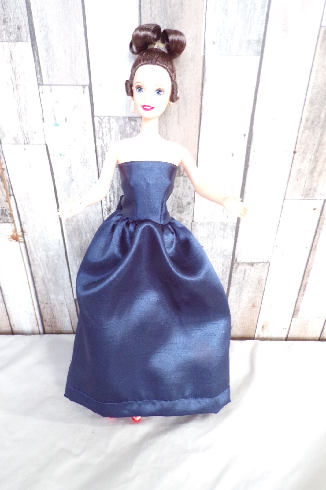Brunette Barbie Claire updo hair side ringlets blue/violet eyes satin blue gown