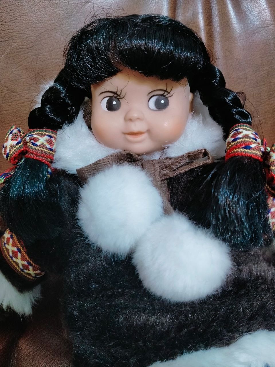 Plastic doll with a sign (Environmentally friendly) With a dense fabric body.