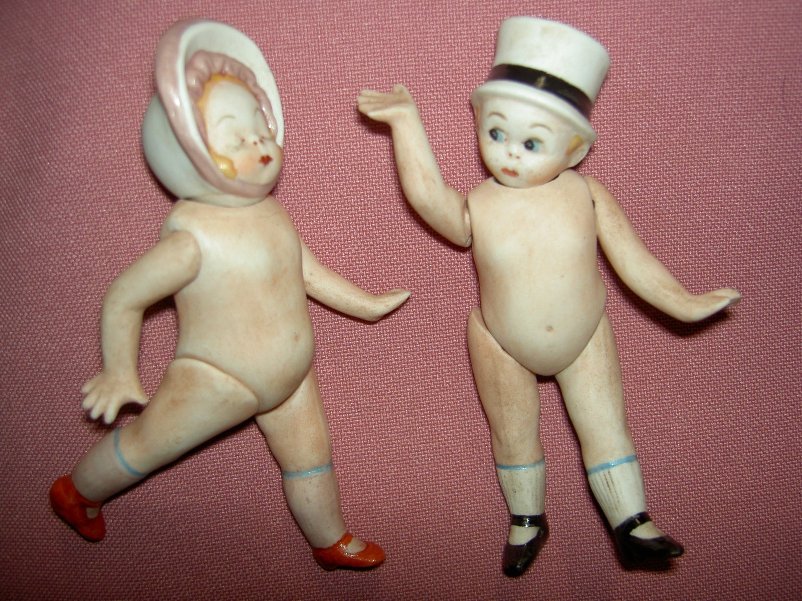 Pair, RARE antique German, 4″, all bisque, jointed dolls w/ swivel necks & hats