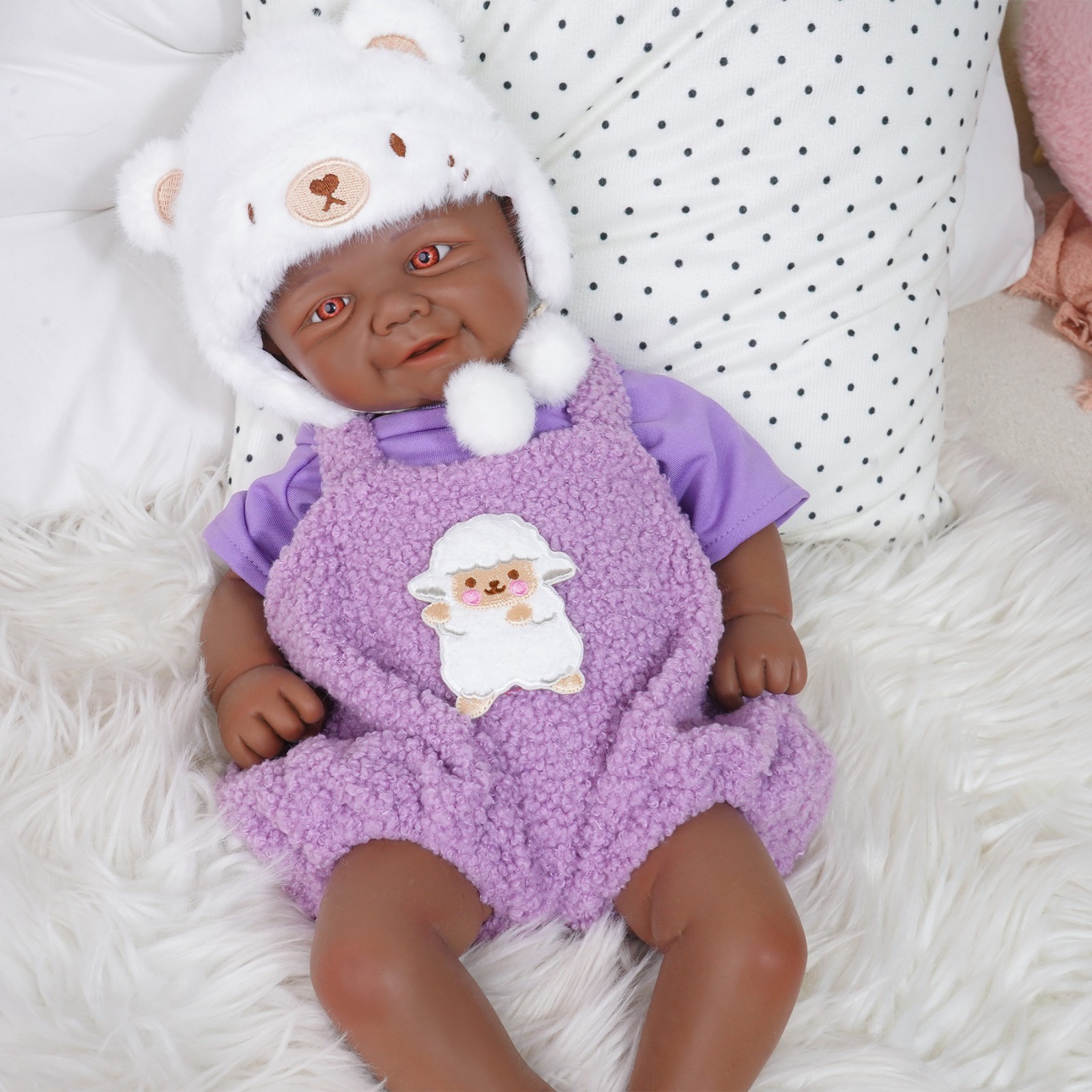 17-inch realistic silicone doll, posable, with open eyes and a smiling face.