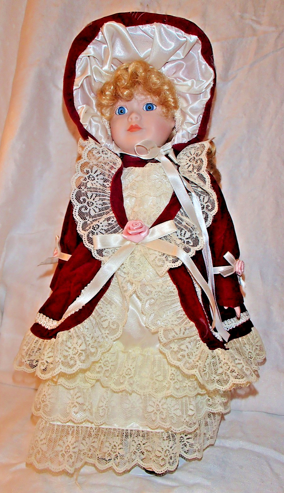 Porcelain/Glass 16″ Doll Blonde Curly Hair with Burgundy & Ivory Clothes