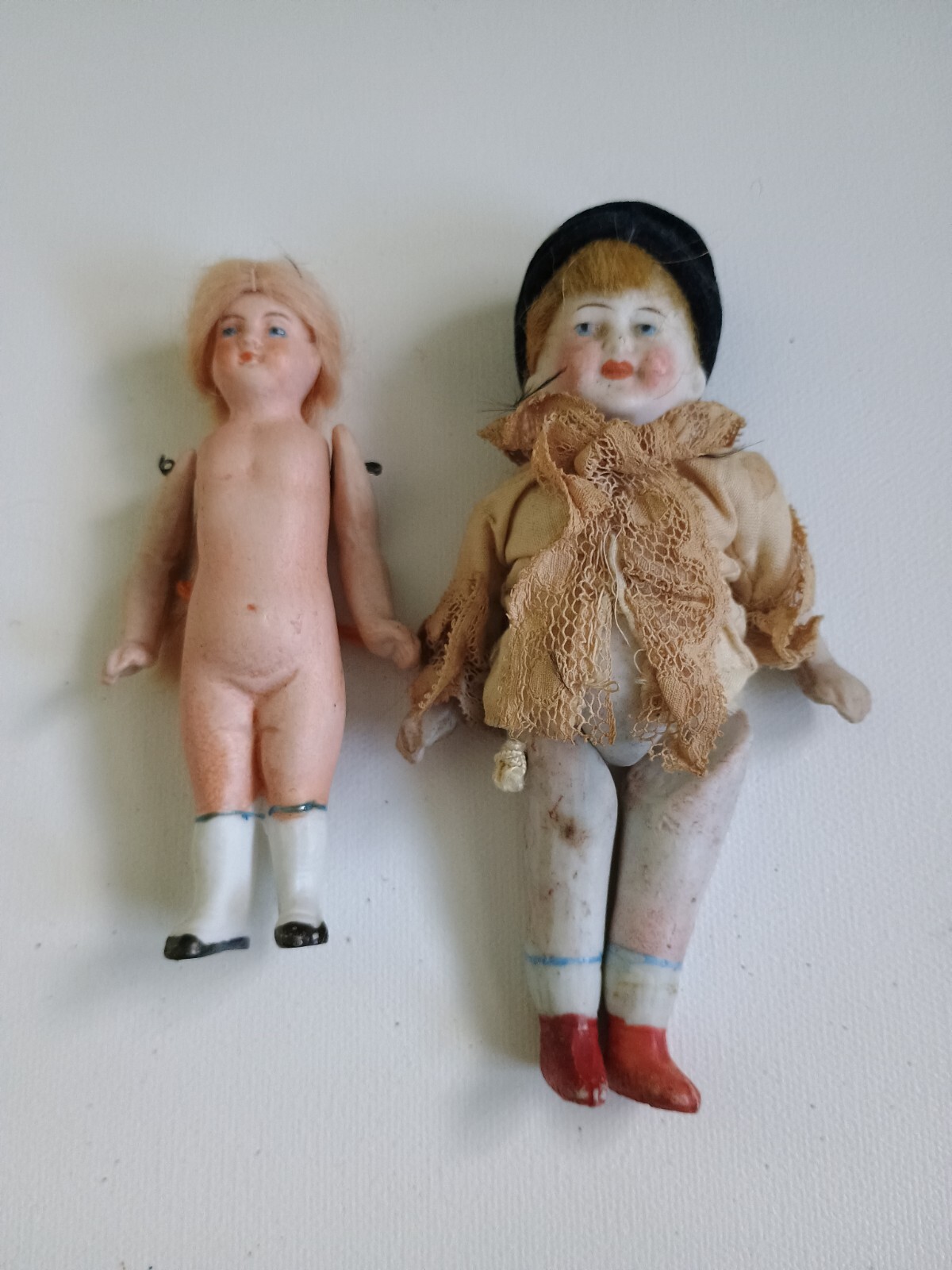 2 Antique All Bisque dolls Both are marked Boy Germany Girl J 947 5″ & 3-1/2″