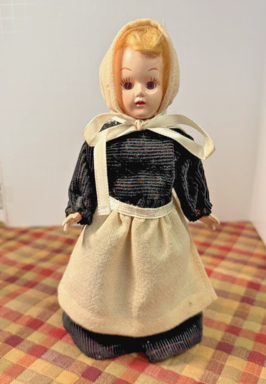 Vintage 8″ Amish girl doll hard plastic, straight legs & sleepy eyes