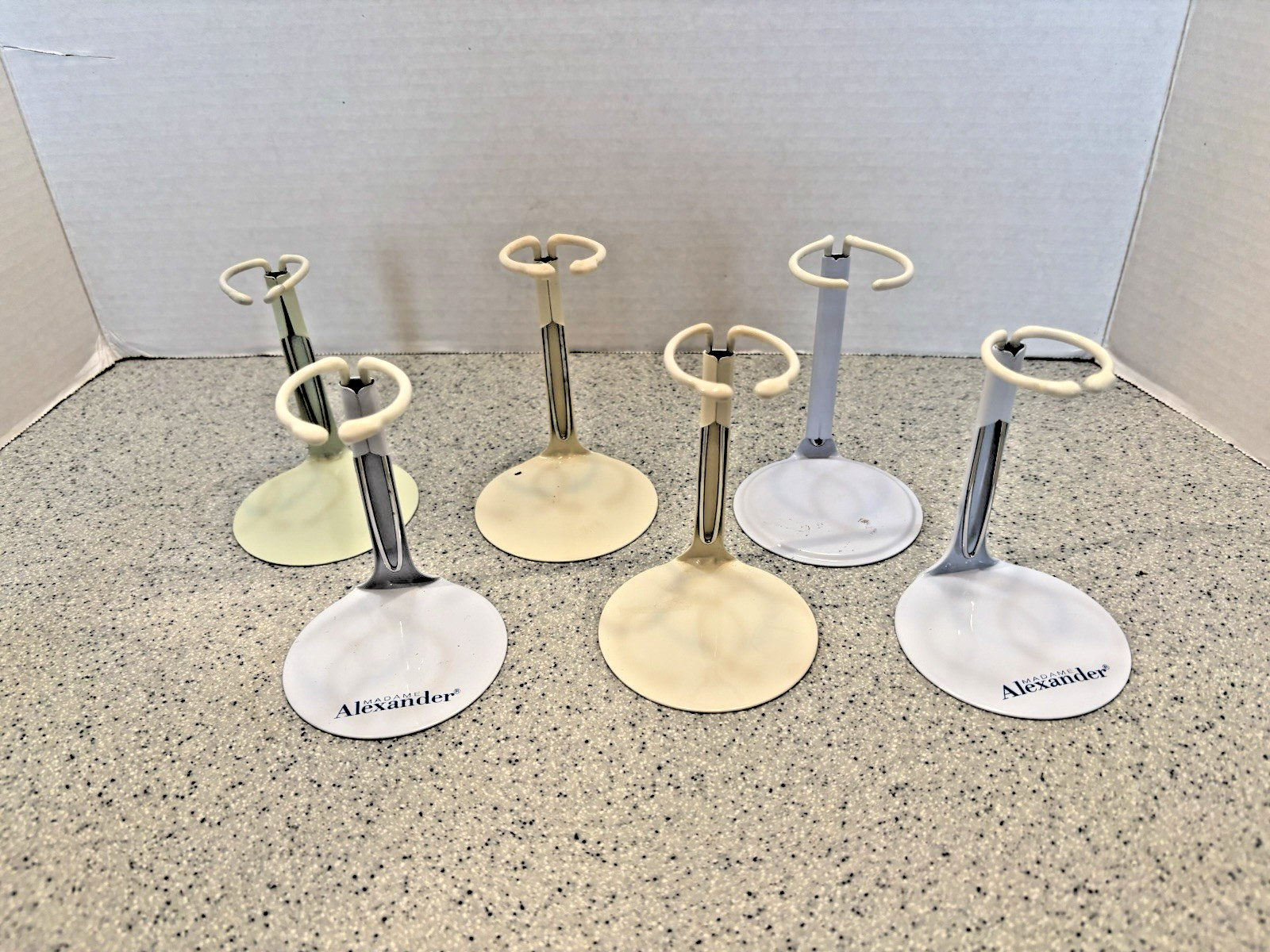 METAL DOLL STANDS – LOT OF 6 DOLL STANDS, ALL 4-6 INCHES TALL, EX. CONDITION