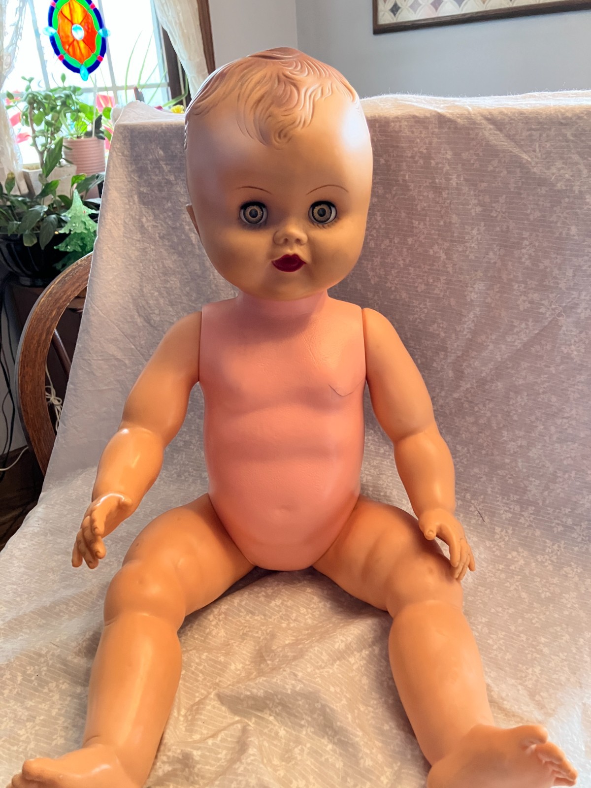 24 inch baby doll. 1960’s. Drink and wet. Wears 12 mo. Clothing. Crack in th