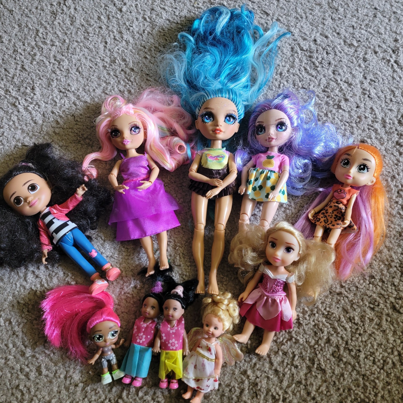 Set of 10 dolls from various collections. Sizes: 10″, 8″, and 5″.